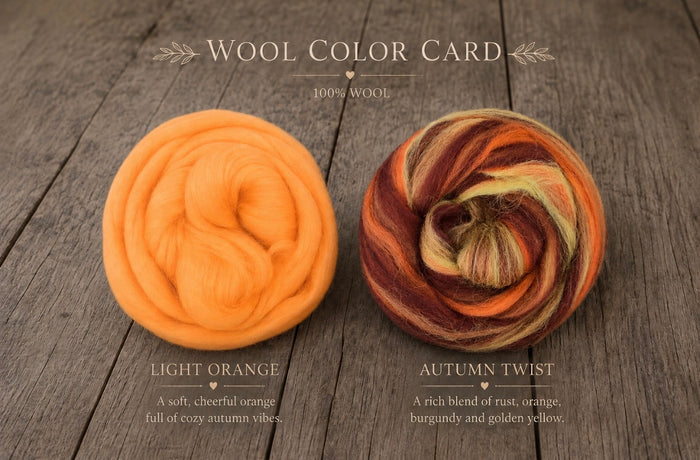 A wool color card for Fluffy Marshmallow Blankets displaying two types of wool: a bright light orange ball labeled 'LIGHT ORANGE' and a marled autumn blend labeled 'AUTUMN TWIST'. The image is set on a rustic dark wood background with elegant serif text at the top and bottom.