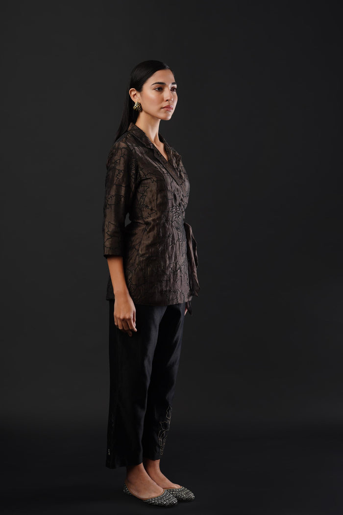 Embroided co-ordinated set featuring a coat paired with trousers.