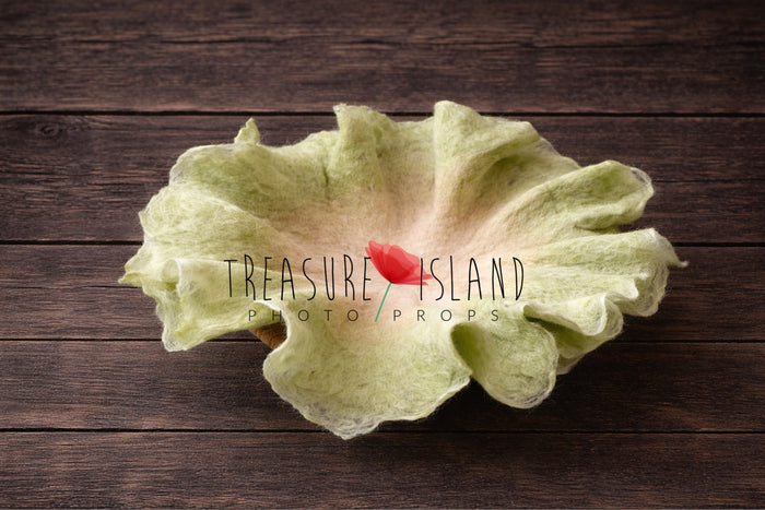 Petal Nest Blanket – Blush Cloud, hand felted newborn photography prop in soft spring green with creamy center, organic flower shape, luxury fine art baby photo styling backdrop