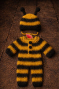 Hand-knitted bee romper and bonnet photography outfit in yellow and black stripes