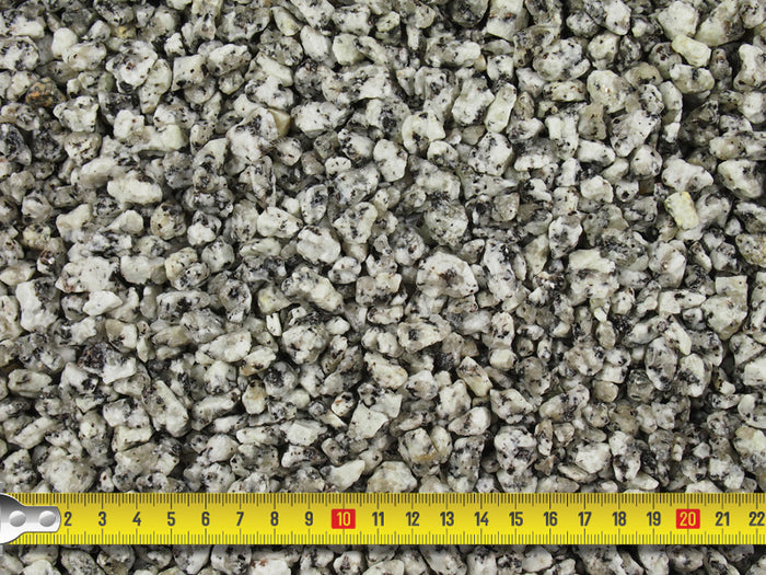 Measuring tape demonstrating the size of the 10mm silver blue gravel