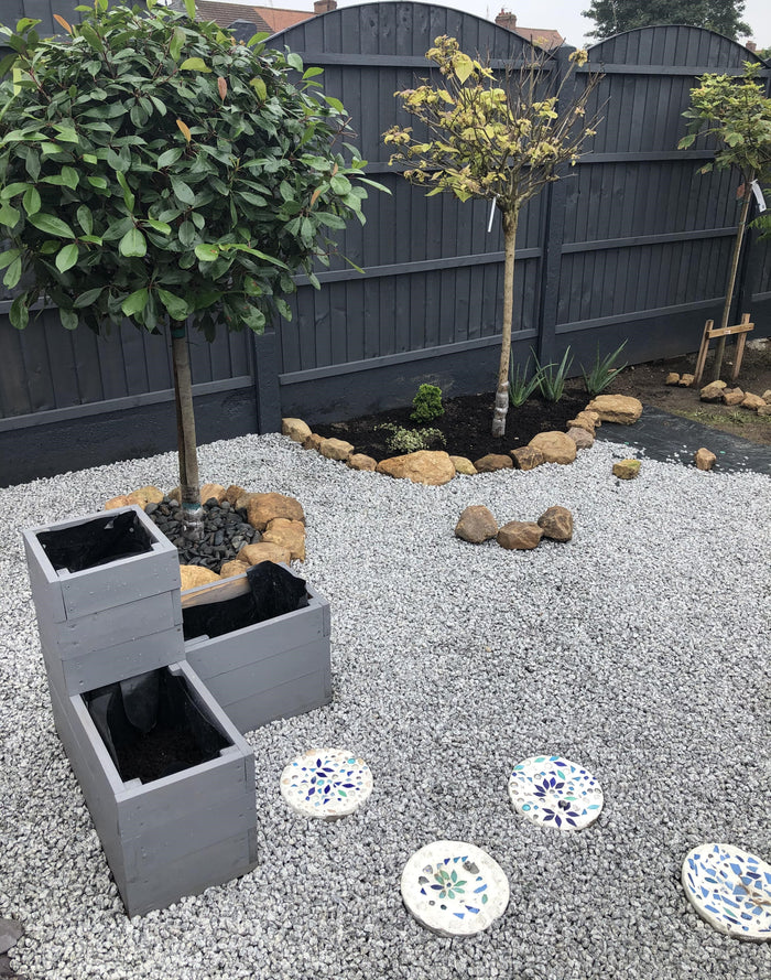 A customer's garden, using silver blue granite gravel as ground cover