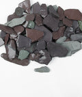 A collection of Snowdonia tumbled slate pebbles in shades of blue, plum, and green, with some flat and some rounded edges.