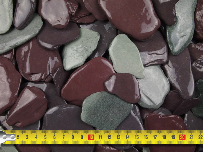 A measuring tape demonstrating the size of the slate aggregate (20-40mm)
