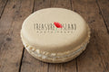 Cream styrofoam macaron prop on rustic old wooden floor, textured faux macaron for newborn and cake smash photography styling, neutral beige photo prop